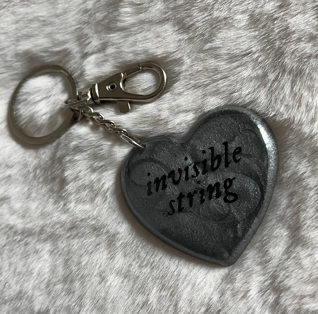 Llavero invisible string