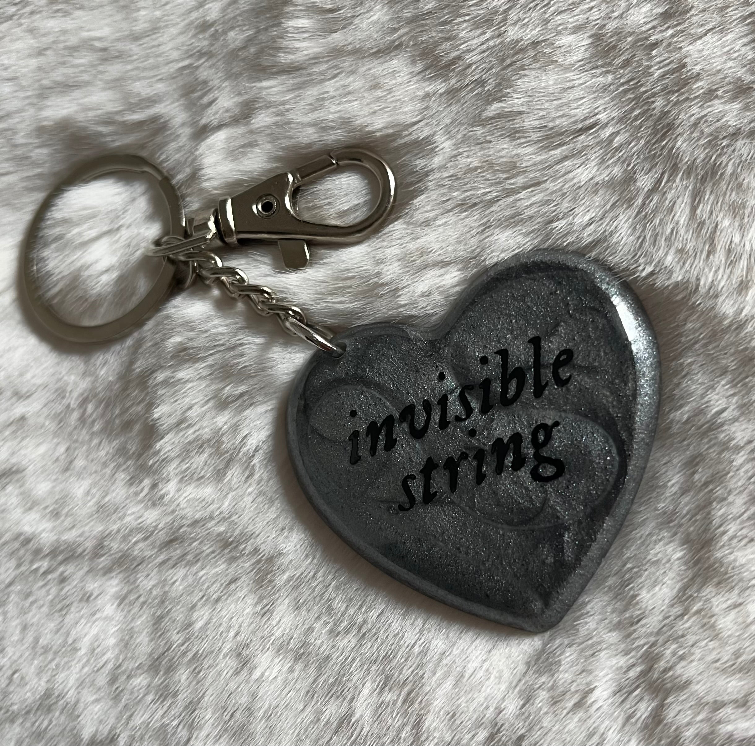 Llavero invisible string