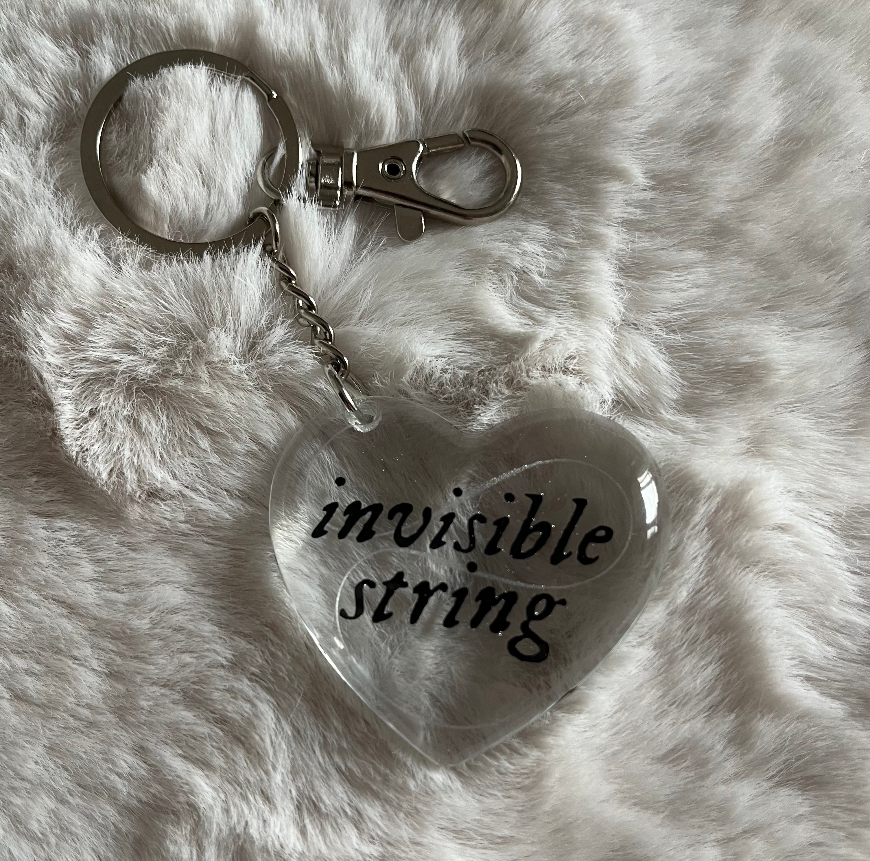 Llavero invisible string