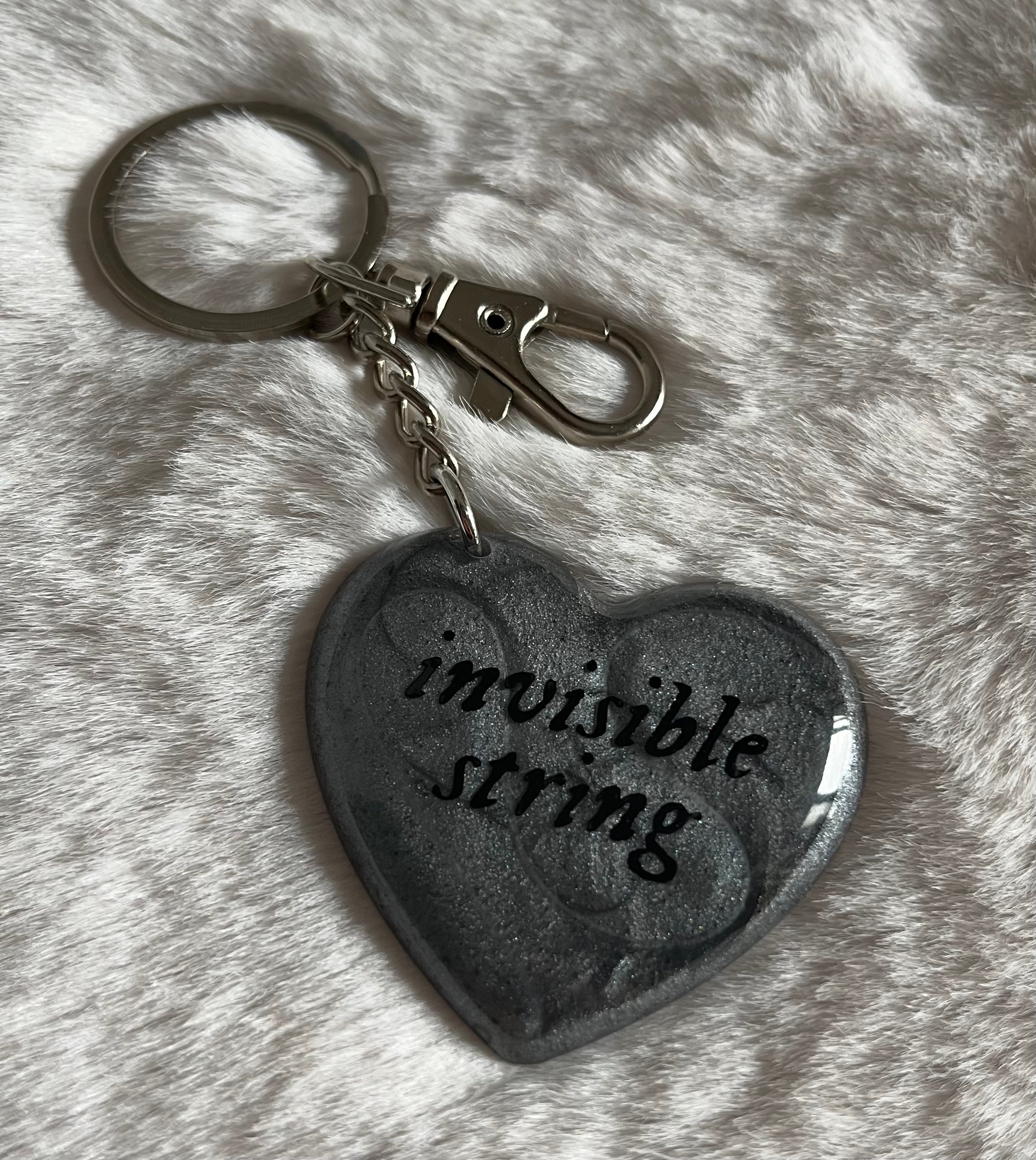 Llavero invisible string