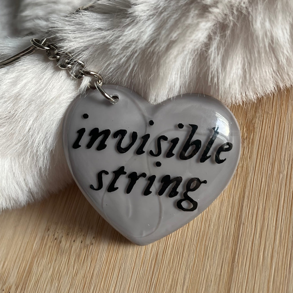 Llavero invisible string