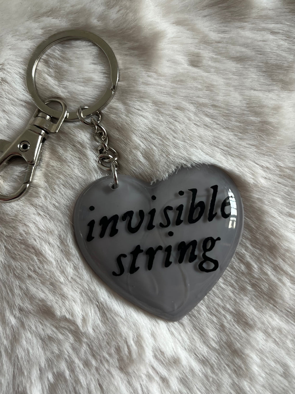 Llavero invisible string